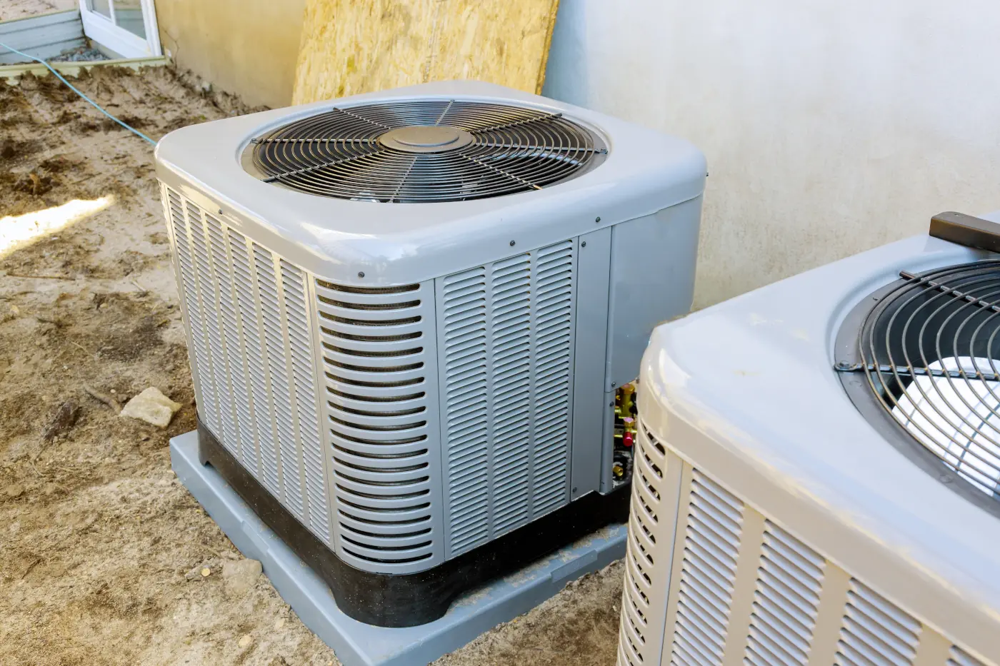 two heat pump units outside