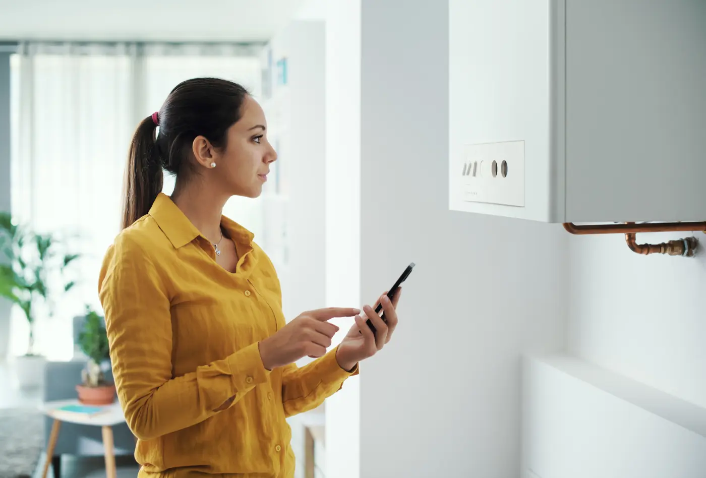 gas water heater lady checking with technician over the phone