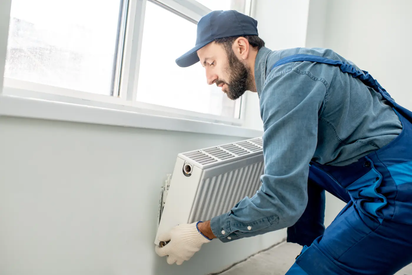 hvac technician installing gas stove heating