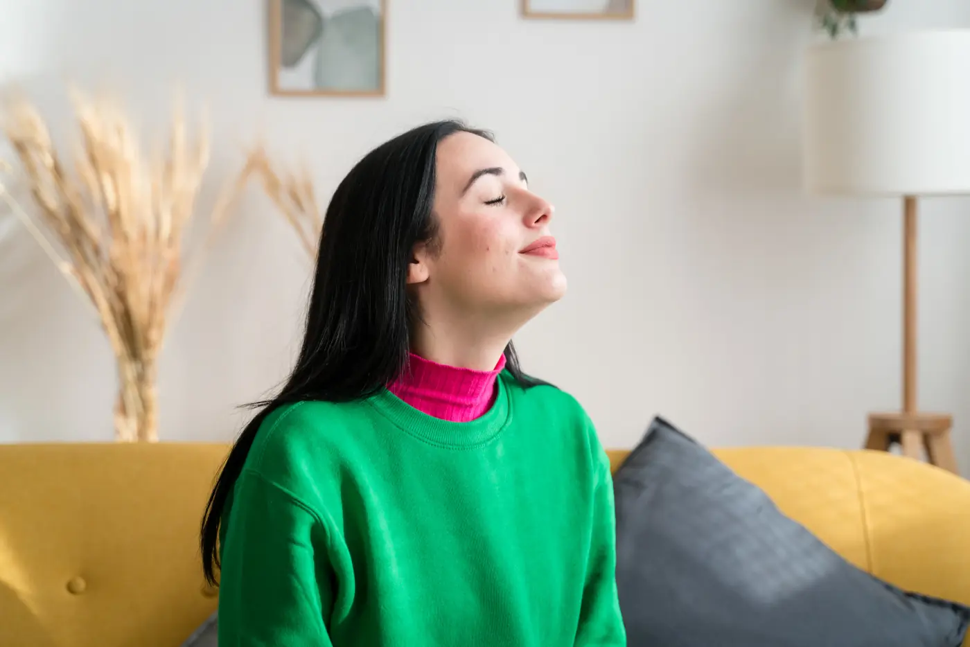 woman breathing clean air at her home